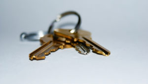 keys sit on a table, waiting to be used by a denver commercial locksmith